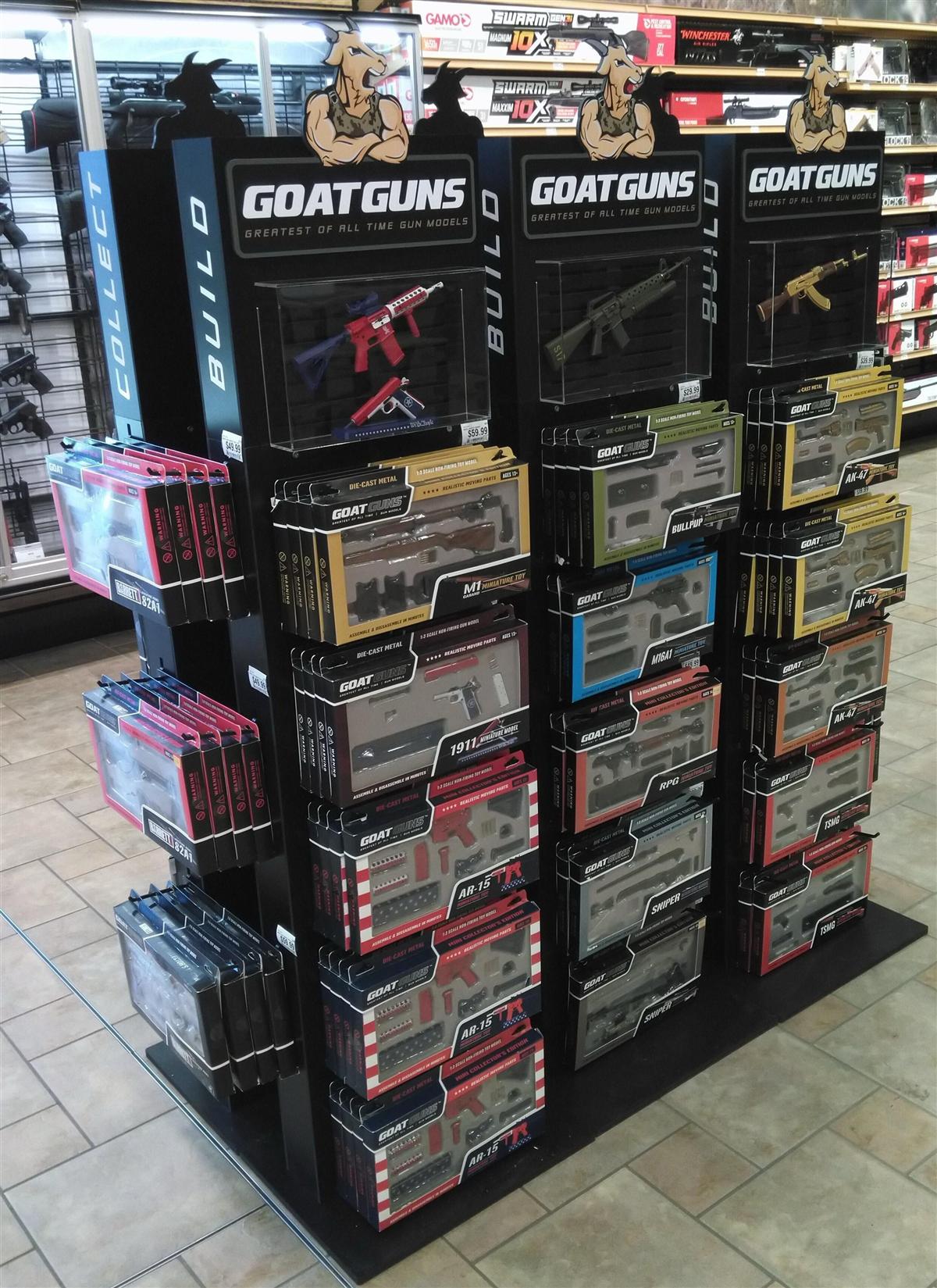 GoatGuns retail display stocked with packaged miniature models
