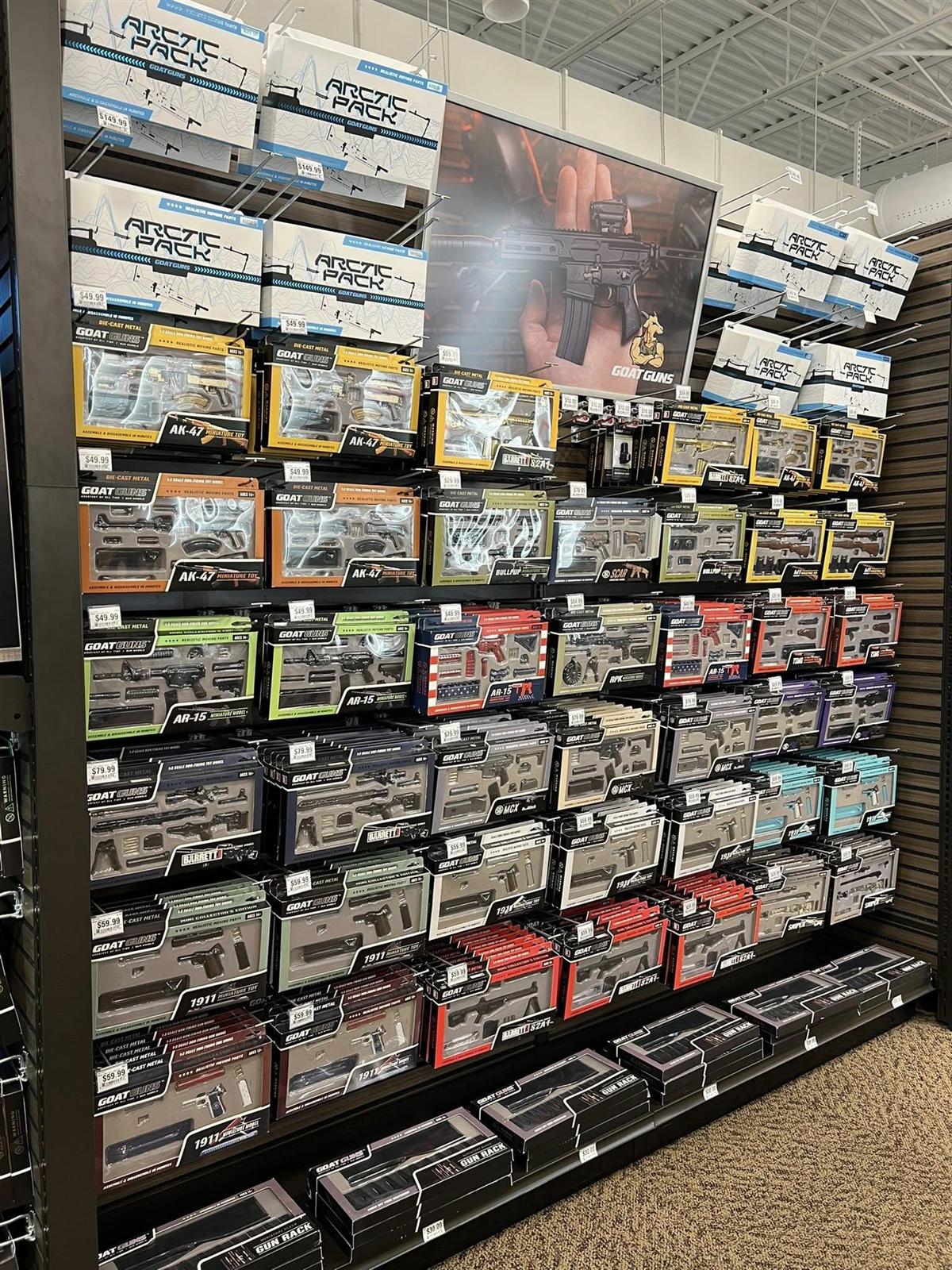 GoatGuns boxed models on display in a retail store